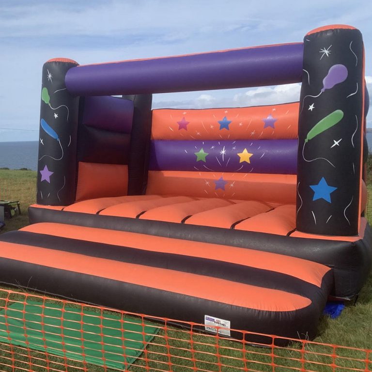Open topped purple and orange bouncy castle
